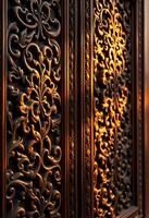 close up of a metal door with intricate designs photo