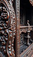 close up of a wooden cabinet with carvings on it photo