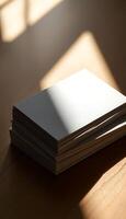 stack of books sitting on top of a wooden table photo
