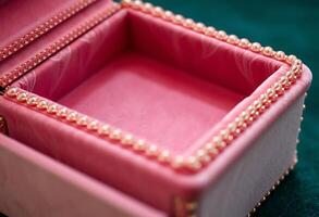 close up of a pink box with pearls photo