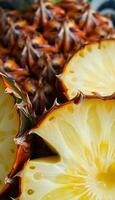 close up of a pineapple fruit cut in half photo