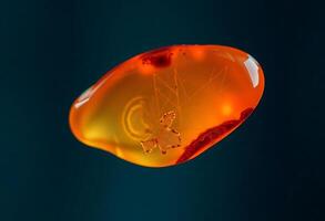close up of an orange object with a blue background photo