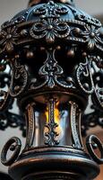 close up of a light fixture with a candle in it photo