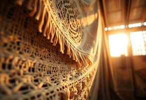 close up of a crocheted blanket with a window in the background photo