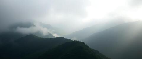 view of the top of a mountain on a cloudy day photo