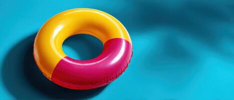 Vibrant rubber ring floating in turquoise water summer fun lifestyle serene viewpoint photo