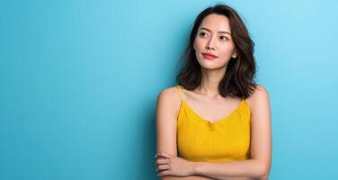 Captivating asian woman with nice body posing in bright blue background lifestyle photography studio environment photo