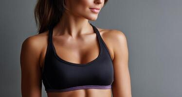 Dynamic fitness pose by female model in studio setting close-up lifestyle shot for health enthusiasts photo