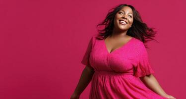Radiant plus-size woman twirling in stylish pink dress studio setting joyful concept photo