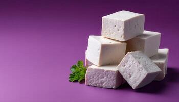 Minimalistic tofu slices on light gray surface food photography simple aesthetic photo
