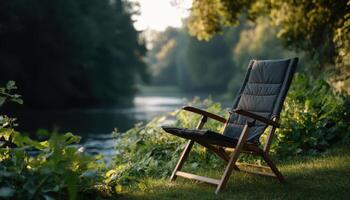 Lone camp chair by tranquil river nature scene peaceful environment minimalist viewpoint photo