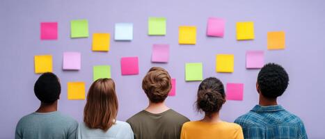 Creative business team brainstorming ideas with sticky notes in modern office environment photo