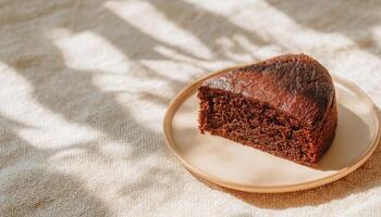 Chocolate cake slice overhead shot on plate natural light setting food photography photo