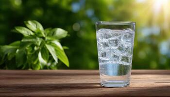 Refreshing ice-cold water in a clear glass outdoor natural setting lifestyle shot bright environment photo