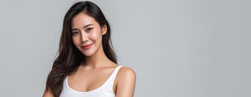 Elegant asian woman posing in studio model photography copy space warm environment close-up view photo