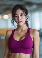 Fitness enthusiast posing in gym health and wellness indoor eye-level motivational concept photo