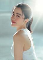 Captivating portrait of a young woman studio setting photography bright environment close-up beauty and confidence photo