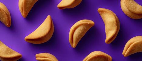 Artistic arrangement of fortune cookies on bright purple background food art bold colors creative viewpoint photo