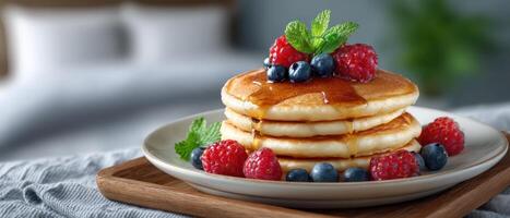Delicious pancake stack with fresh berries and syrup kitchen food photography cozy atmosphere top view photo