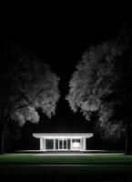 Illuminated modern glass structure at night architectural photography serene environment photo