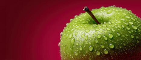 Closeup of a droplet-covered ripe green apple studio setting macro photography vibrant background photo