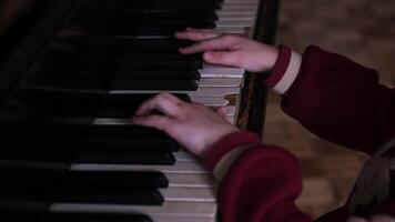 moscow, russia, 09.04.2025 A child is playing the piano with their hand on the middle keys video
