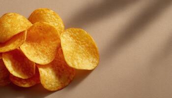 Crispy potato chips arrangement on beige background food photography elegant presentation minimalistic view photo