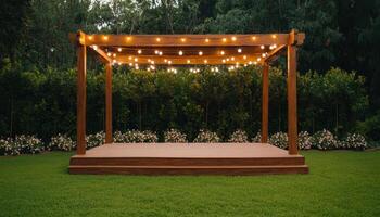 Charming wooden stage with string lights on lush green lawn outdoor event setup serene atmosphere photo