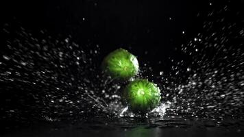 Cucumbers falling on a black background. Filmed on a high-speed camera at 1000 fps. High quality FullHD footage video