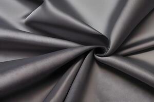 Elegant draped gray fabric showcases a beautifully textured surface, adding a touch of sophistication to any setting. photo