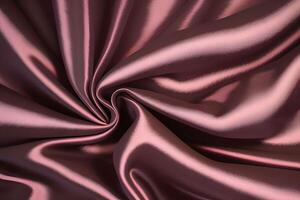 Elegant draped rose gold satin fabric showcases a luxurious texture that captivates the eye. Its soft, shimmering surface adds a touch of sophistication and refinement to any setting. The gentle photo