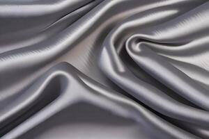 Elegant Draped Silver Satin Fabric Texture creates a captivating visual appeal, characterized by its smooth and lustrous surface that gently cascades charmingly. This exquisite texture captures t photo