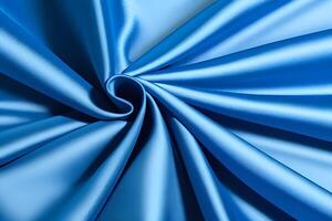 Abstract The swirling texture of blue satin fabric presents a truly mesmerizing visual experience. Its vibrant shades and graceful patterns contribute to a dynamic flow, evoking a profound sense photo
