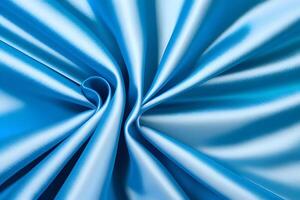 Abstract Swirling Blue Silk Fabric Texture presents a captivating visual experience. The intricate patterns and rich hues of blue create a stunning interplay, evoking a sense of elegance and flui photo