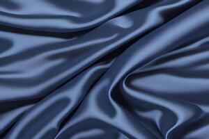 The texture of the elegant draped blue satin fabric exudes sophistication and refinement. Its smooth, flowing appearance adds a touch of luxury and grace. photo