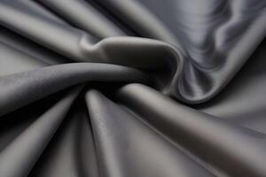 Elegant draped gray fabric features a luxurious texture that beautifully enhances any background. Its smooth surface adds a touch of sophistication and elegance. photo