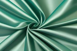 The luxurious teal silk fabric cascades beautifully, radiating opulence with its stunning drape and remarkable texture, making it perfect for creating a captivating backdrop. photo