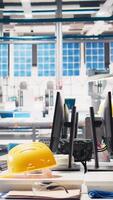 Vertical Monitors in photovoltaics factory used to manage performance of robot arms placing solar panels on assembly lines. PC screen in empty facility used for upgrading solar cell machinery. video