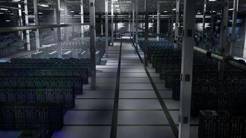 Hardware in dimly lit server hub managing computing resources essential for big data analytics. Rackmounts in data center storing information for predictive maintenance, jib down shot video
