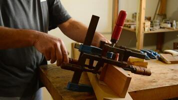 Luthier working on a mastil of flamenco guitar video