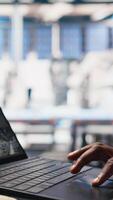 Vertical Solar panels male worker analyzing performance data on laptop and optimizing efficiency. Photovoltaics factory engineer working on innovative solar cells design prototype, high tech. Camera B. video