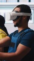 Vertical African american technician in solar panels plant using VR goggles, optimizing layouts using CAD software. Photovoltaics factory worker using virtual reality tech to do arrangements. Camera A. video