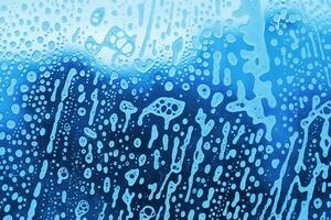 Abstract soap foam pattern on glass photo