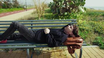 Man Relaxing In The Nature Near The Sea On A Bench video