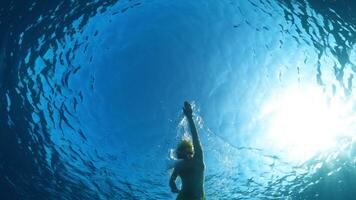 Swimmer Training For Long Distance Swim In The Deep Ocean Under The Sun video