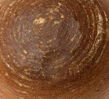 Texture of round rye bread, full frame photo
