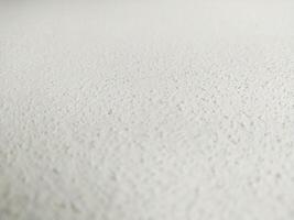 Detailed shot of a textured, light surface, creating depth. Abstract, minimalist backdrop for adding text or graphics. Perfect for design or presentations. photo