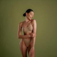 Smiling, ,cheerful ,facial expression.. Woman with slim body shape is posing against background photo