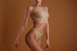 Fitness, slim ,body shape. Woman is posing against background photo