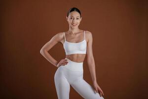 Front ,view. Beautiful fitness, woman, is in the studio photo